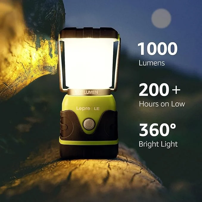 A battery camping lantern photographed on a dark background