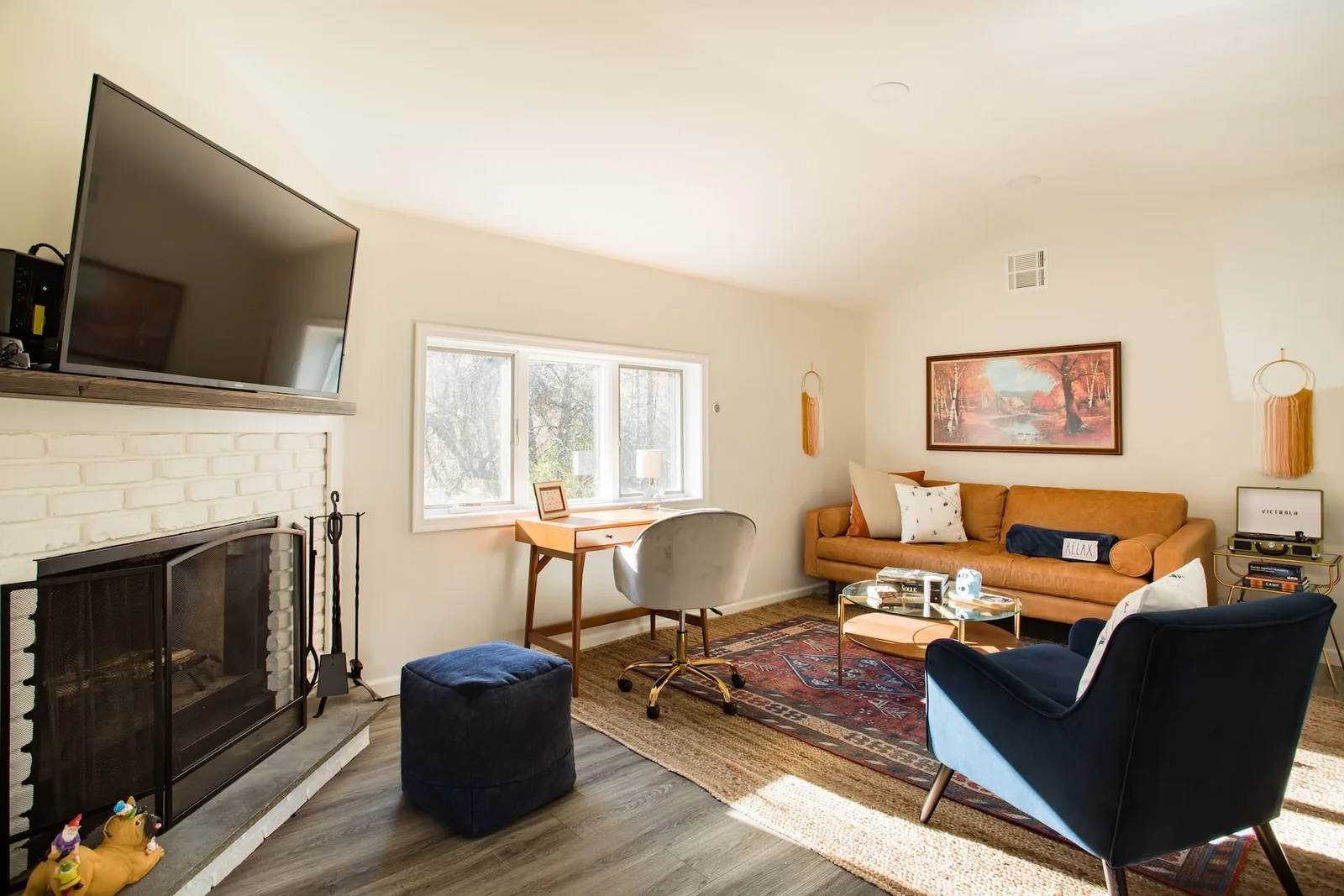 Living room with a fireplace at Clove Creek Cabin in Hunter, NY