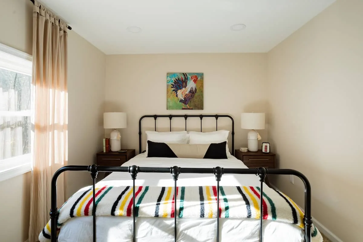 Queen bedroom at Clove Creek Cabin with a striped wool blanket